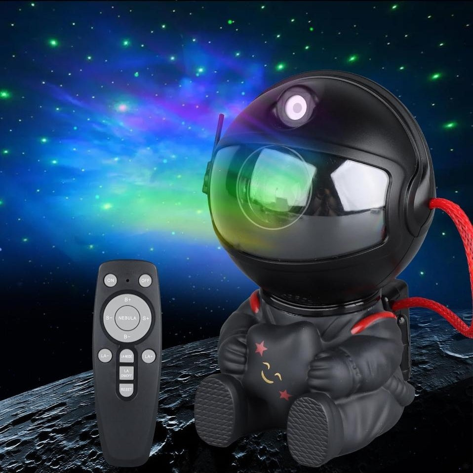 AURBITAL astronaut projector, Original Black, sitting and hugging a smiling star, with remote