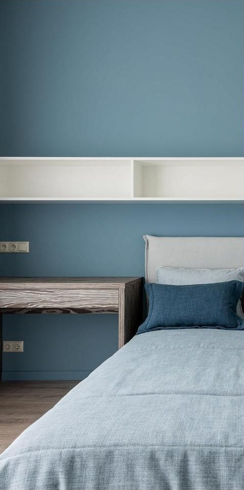 A bedroom with the lights on, before using AURBITAL